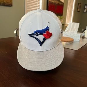 New Era fitted Blue Jays hat.